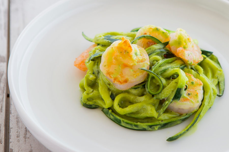 Avocado zucchini noodles with shrimp on plate