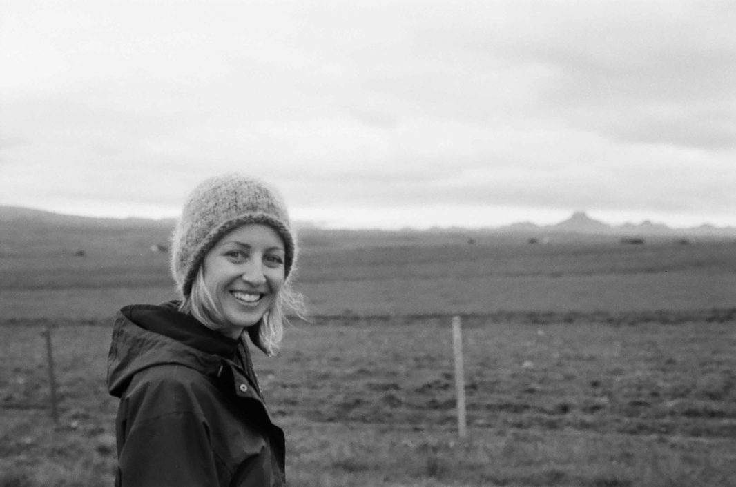 Black and white photo of Learning Beautiful founder and CEO Kim Smith with winter hat and jacket