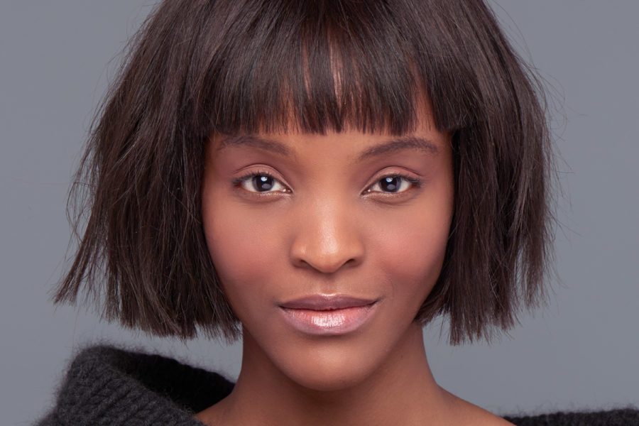 Blunt bob with bangs on model with dark hair