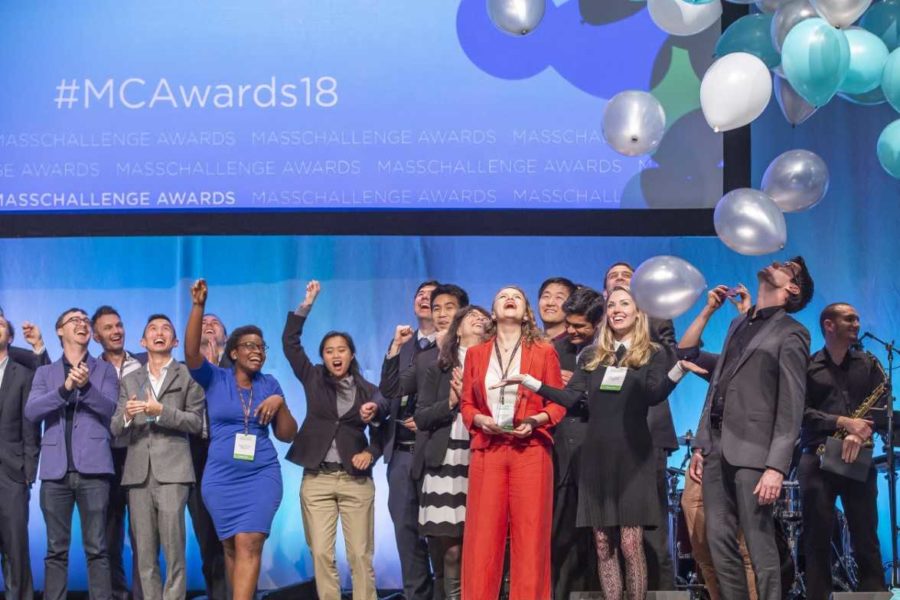 MassChallenge Boston Awards winners on stage with balloons