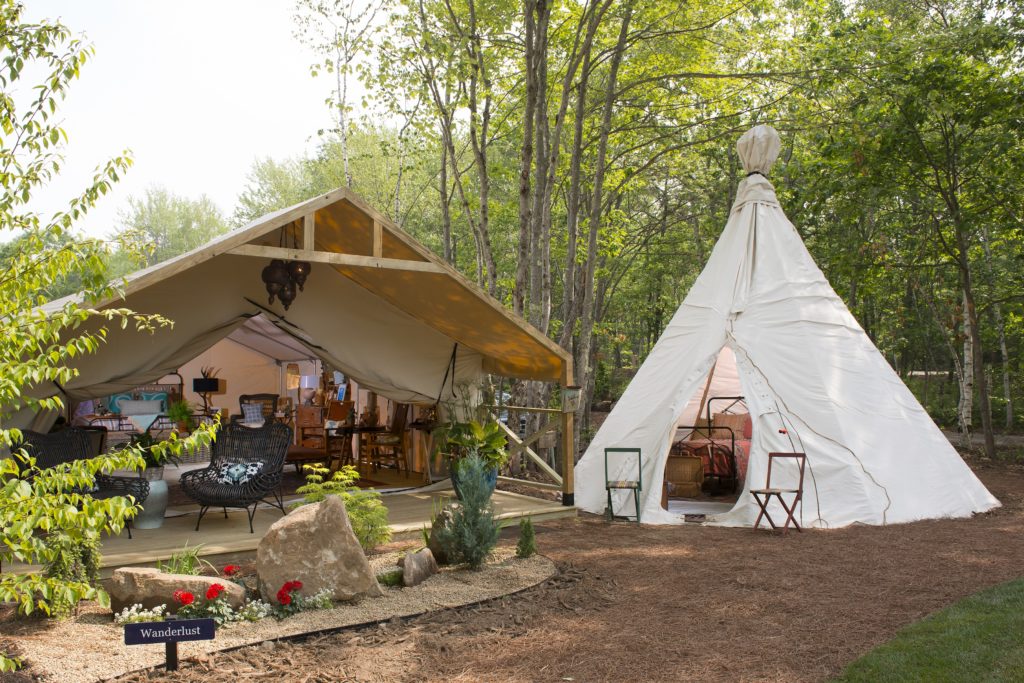 The white teepee tent and tan Wanderlust glamp tent at Sandy Pines looks like an Anthropologie in the wilderness