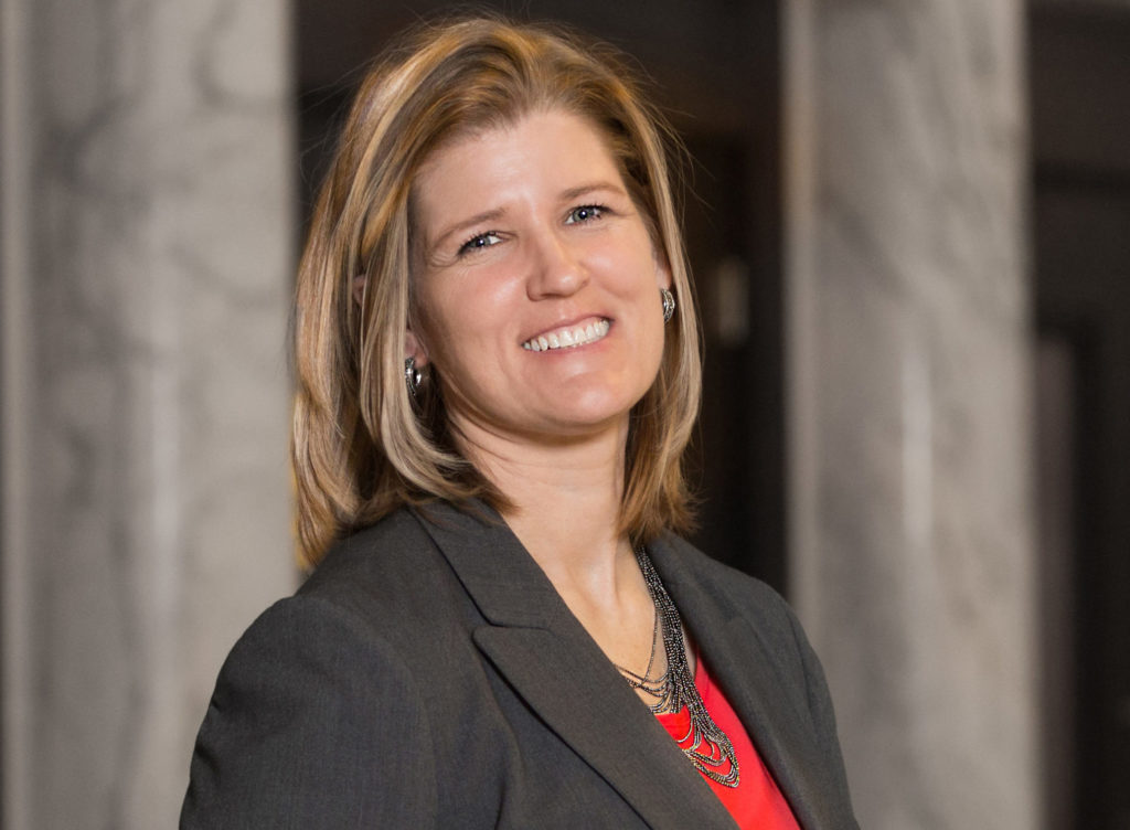 Tracy Lovvorn campaign photo with red shirt and black blazer