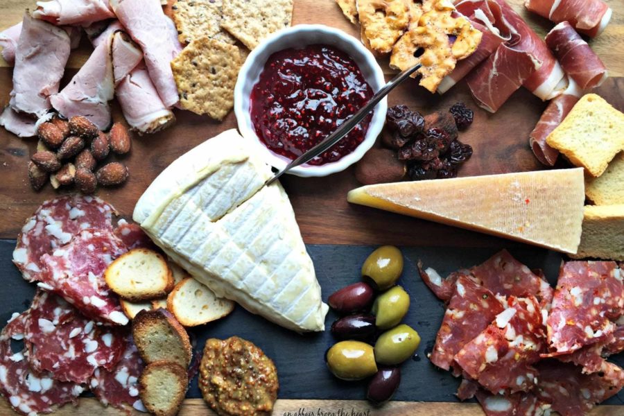 Bantam Cider’s Big Cheese & Charcuterie Party platter with assorted cured meats, cheeses, olives, and crackers photographed from above