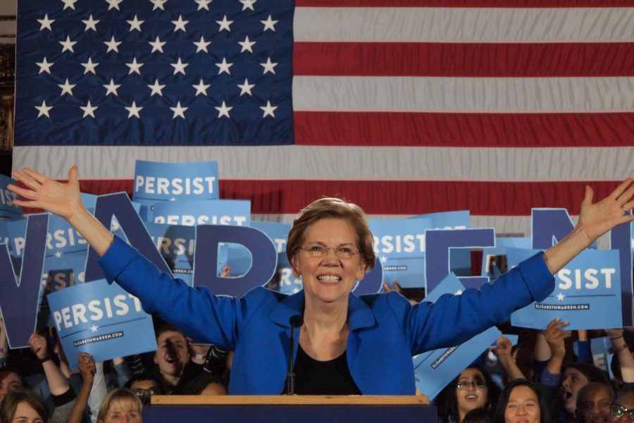 Senator Elizabeth Warren in front of American flag at midterm election night party