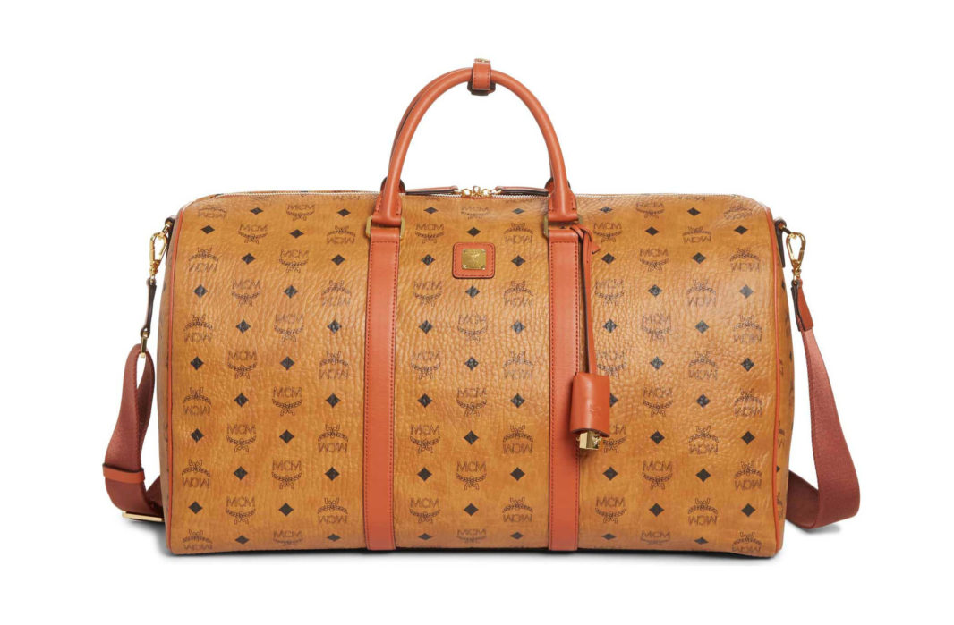 MCM Large Vintage Weekend duffle bag in tan with black "MCM: logo. Top handles and shoulder strap